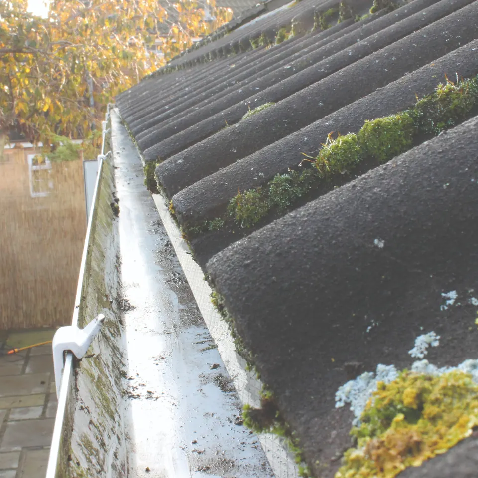 The same gutter and roof valley cleared after cleaning